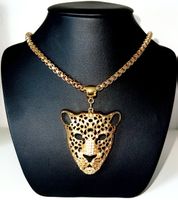 Gold plated steel Jaguar necklace with Swarovski stones.