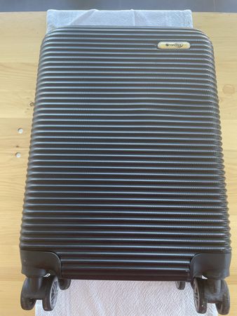 Hartschalenkoffer schwarz – 4 Doppelrollen 