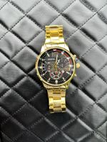 Goldene Uhr aus Edelstahl, wie neu, modern