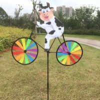 Windmühle Kuh auf ihrem Fahrrad