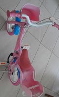 Bicicletta rosa per bambini con rotelle usata