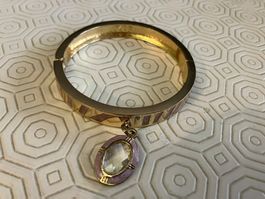 Braccialetto in metallo rigido con pendente oro e lilla
