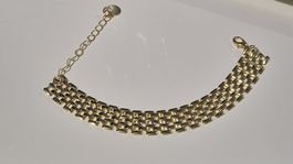 Bracciale dorato a maglia larga con estensore