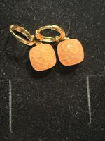 Elegante Ohrringe in Gold mit orangen Schmucksteinen