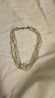 Collana girocollo con giri multipli di perline