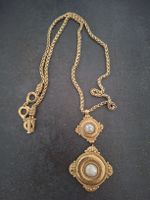 Collier Yves Saint Laurent doré avec perles 
