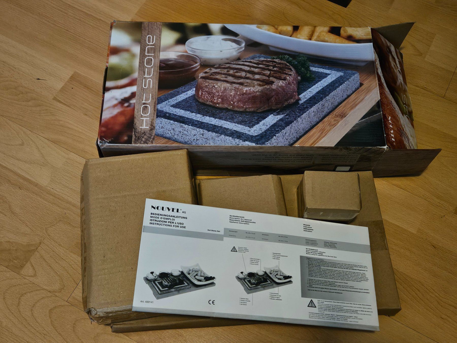 Set di piatti: Hotstone mit Holzunterteller – Nuovo e nell'imballaggio originale da Aesch BL venduto da Chrutli1 1