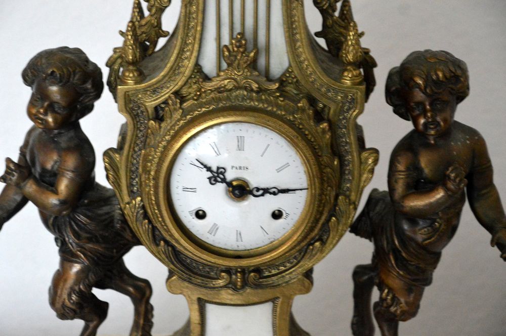 Horloge de cheminée avec personnage - Antique Bronze doré (Bronze doré