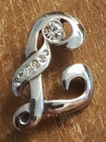 Brosche Monogramm J oder L ca. 3,5cm lang, facett. Steinchen