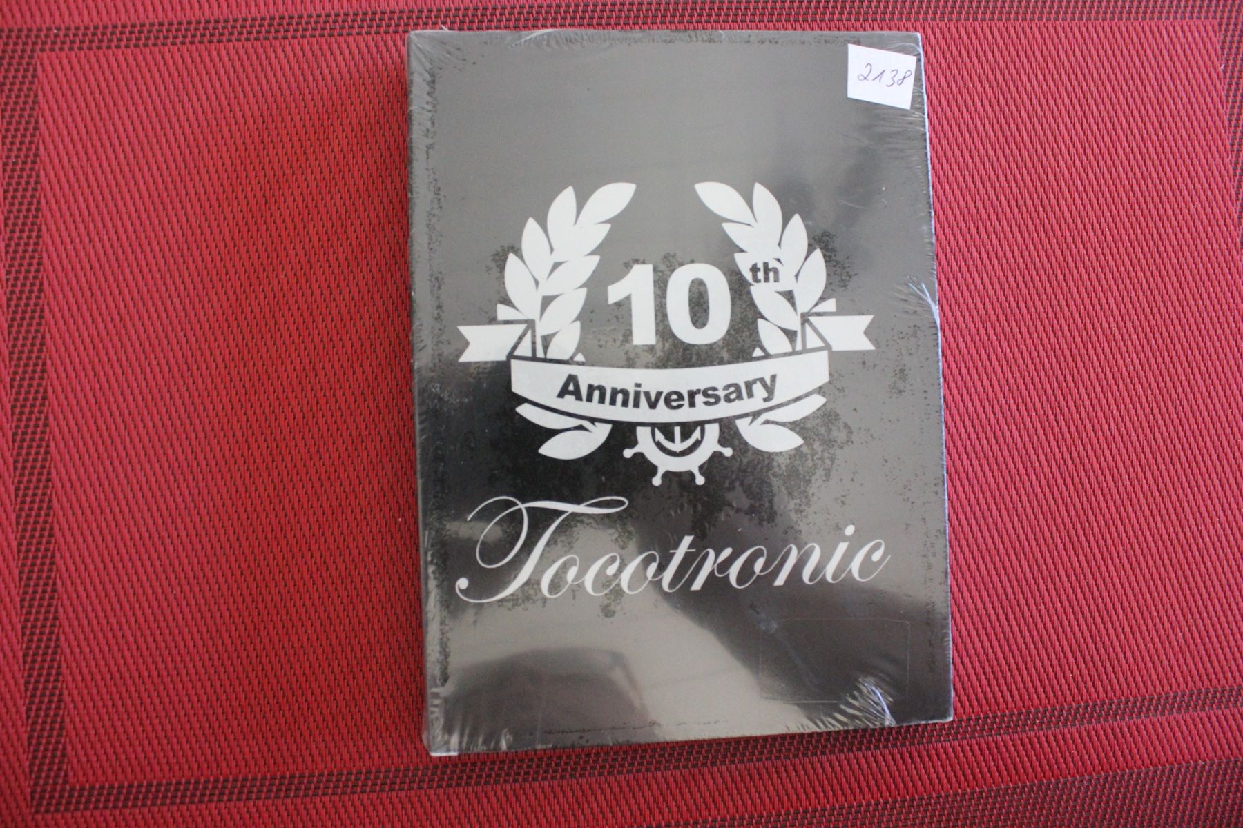 Tutti i DVDs: TOCOTRONIC - 10TH ANNIVERSARY DVD-COMPILATION DVD + CD NEU – Nuovo e nell'imballaggio originale da Geroldswil venduto da Schlumpfine1973