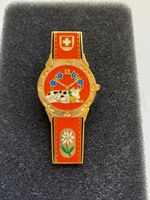 PIN'S - SUISSE - MONTRE - VACHE ET FLEURS