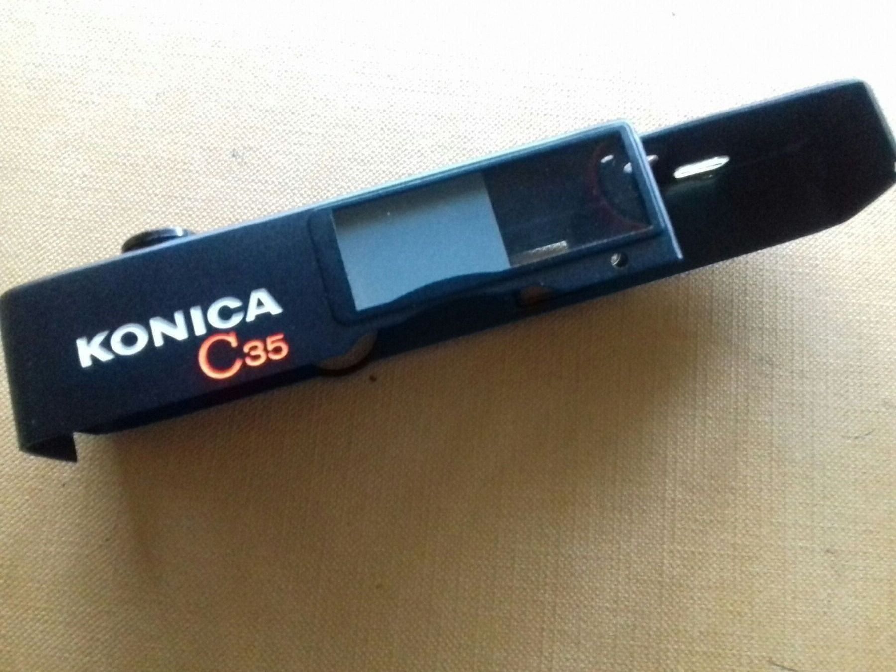 Konica Fotocamera: Konica C  35 Oberteil – Nuovo e nell'imballaggio originale da Greifensee venduto da YMCA1943