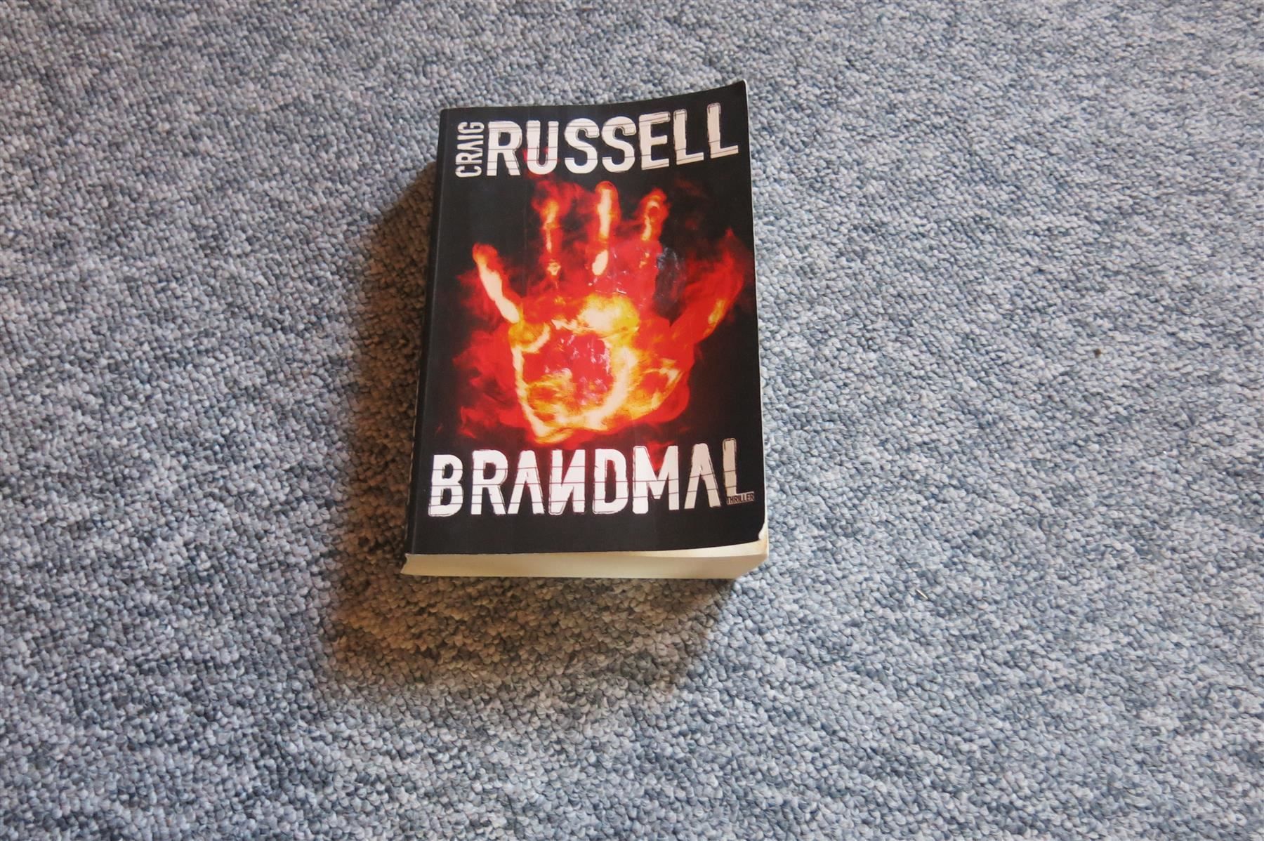 Libri: Russell Craig - Brandmal / Thriller – Usato da Schaffhausen venduto da flohmarktbuecherlaus