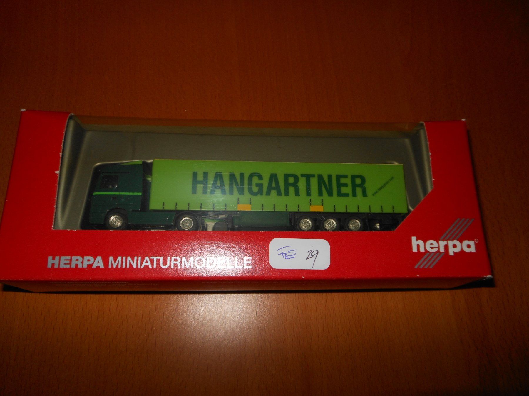 Herpa Modellini d'auto: Herpa Hangartner Sattelschlepper 1:120 – Nuovo e nell'imballaggio originale da Beringen venduto da mar_j2nk