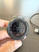 Garmin Instinct 2 Solar Smartwatch with charging cable