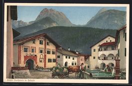 AK Schuls, Dorfplatz mit Oxenkarre