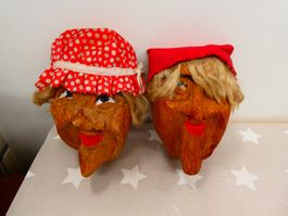 geschnitzte Köpfe