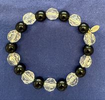 Elastisches Armband mit schwarzen und transparenten Kugeln