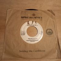 C.C.R. – Travelin' Band / Who'll Stop The Rain, JAMAICAN 7"