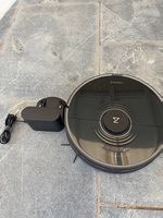 Robot aspirateur laveur Roborock S7 noir  fonctionne