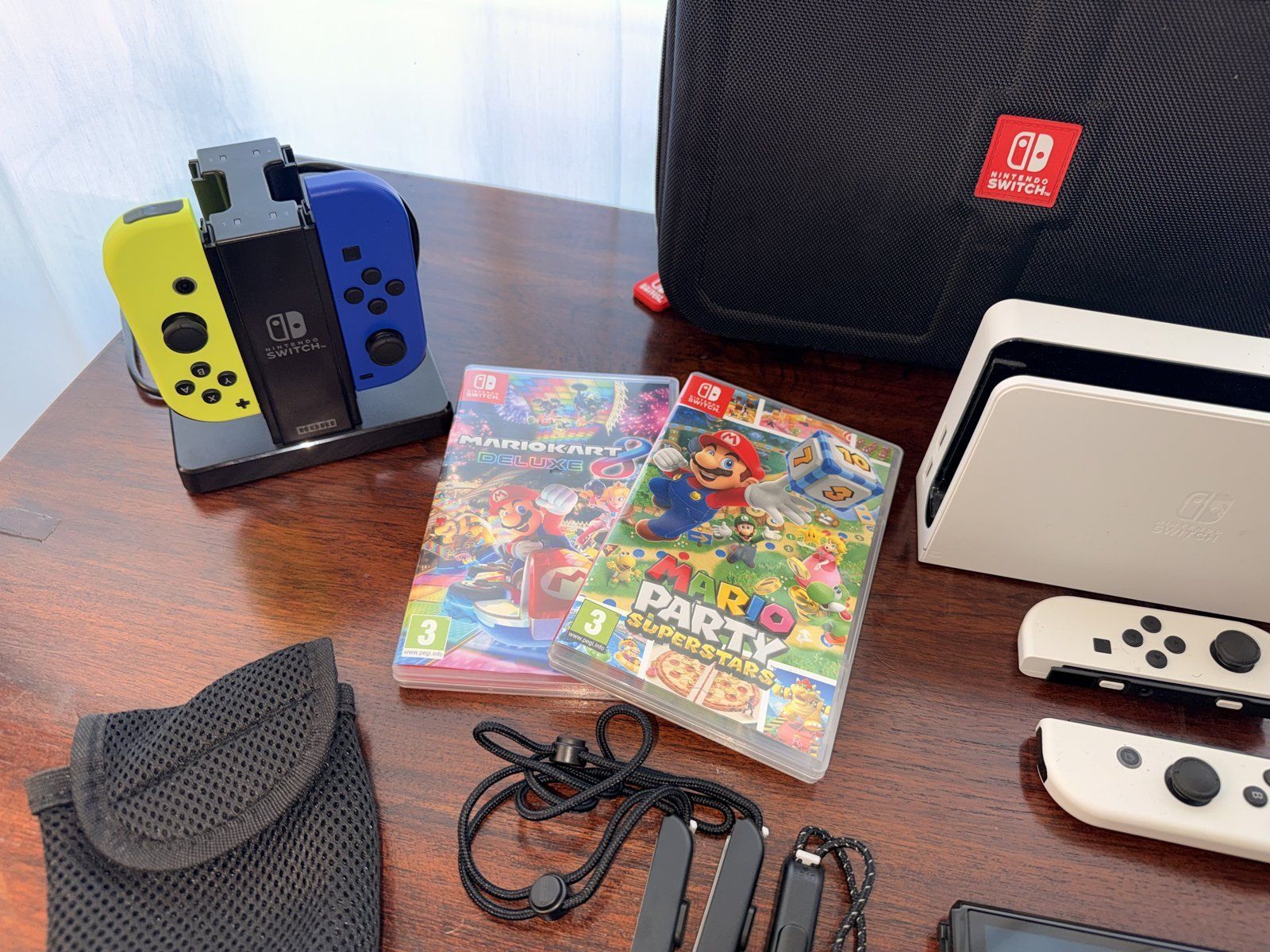 Nintendo Console: Switch OLED Weiss + 4 Joy-Con + 2 Games + Case – Usato da Zürich venduto da swizzmember 2