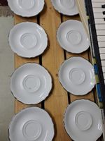 8 Porzellan Unterteller
