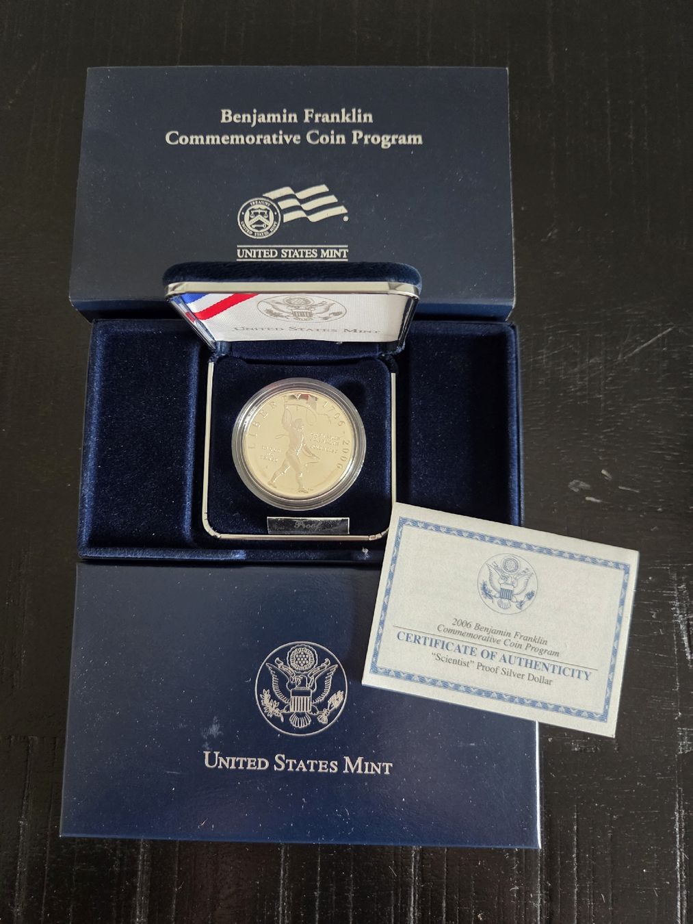 Tutti le monete: 2006 Benjamin Franklin "Scientist" Proof Dollar US Mint 🗽 – Nuovo e nell'imballaggio originale da Basel venduto da Anghkorwatt