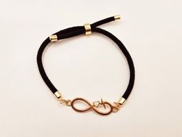 Damenarmband mit Infinity-Symbol in Schwarz und Gold