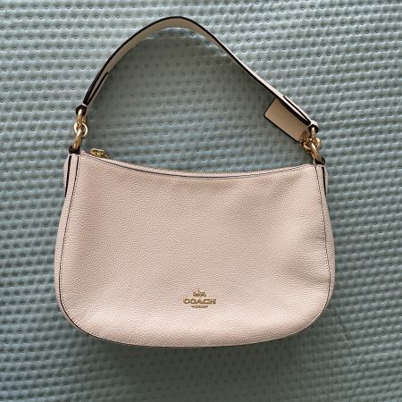Schultertasche Coach in hellem beige