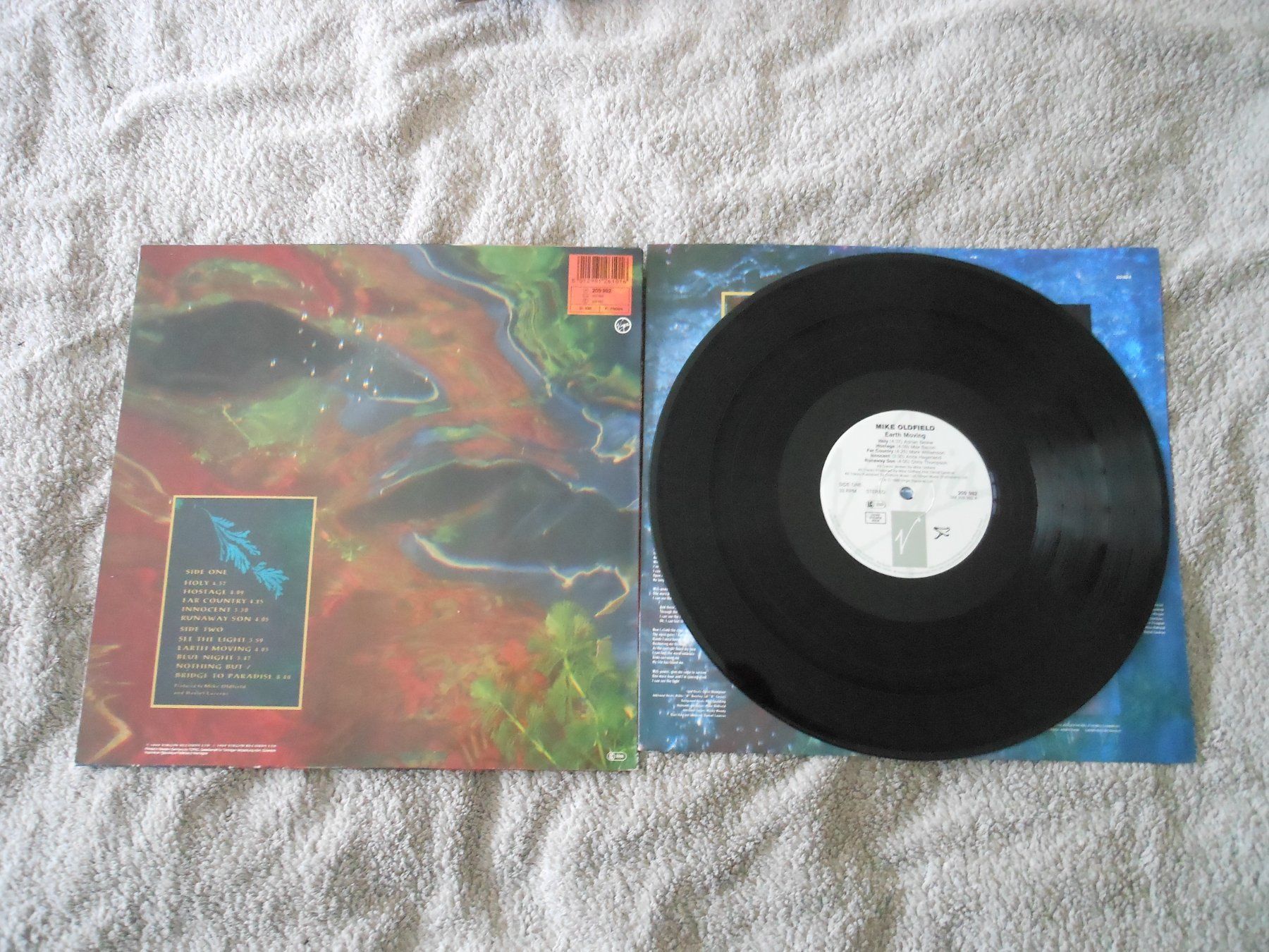 Dischi in vinile: Mike Oldfield – Earth Moving – Usato da Liebefeld venduto da type013 1
