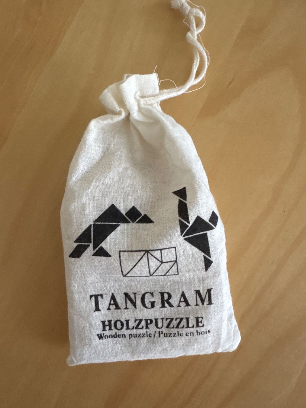Puzzles: Tangram Holzpuzzle im Stoffbeutel – Gebraucht aus Goldach von Hibiskus23