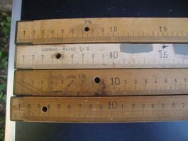 4 Massstäbe, Schwundmeter, 1%,1,5%, 2% und 1 normal Meter.