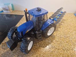 Traktor New Holland mit Pflug, Spielzeug