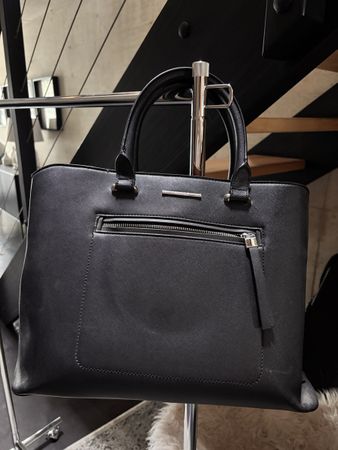 Elegant black tote bag - perfect for work or travel.