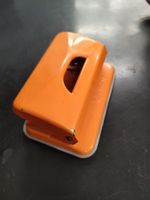 Gratis Locher metall orange