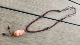 Collier sautoir avec perles noires & perle naturelle orangée