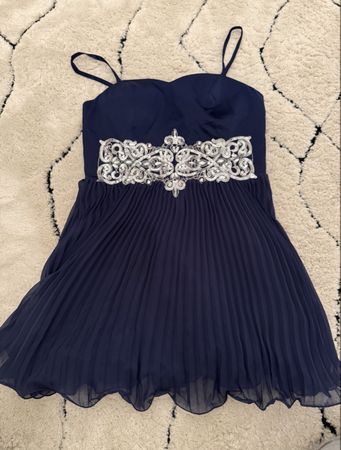 navy blue dress with silver details and ruffles
