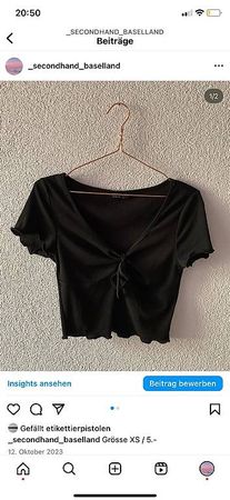 Schwarzes Shirt mit Rüschchen