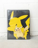Album mit 132 Pokémon Sammelkarten