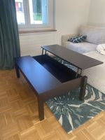 Table basse noire avec plateau levable
