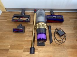 Dyson Staubsauger mit Zubehör und Ladekabel