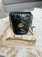 Gucci GG Marmont mini bucket bag in black matelassé leather