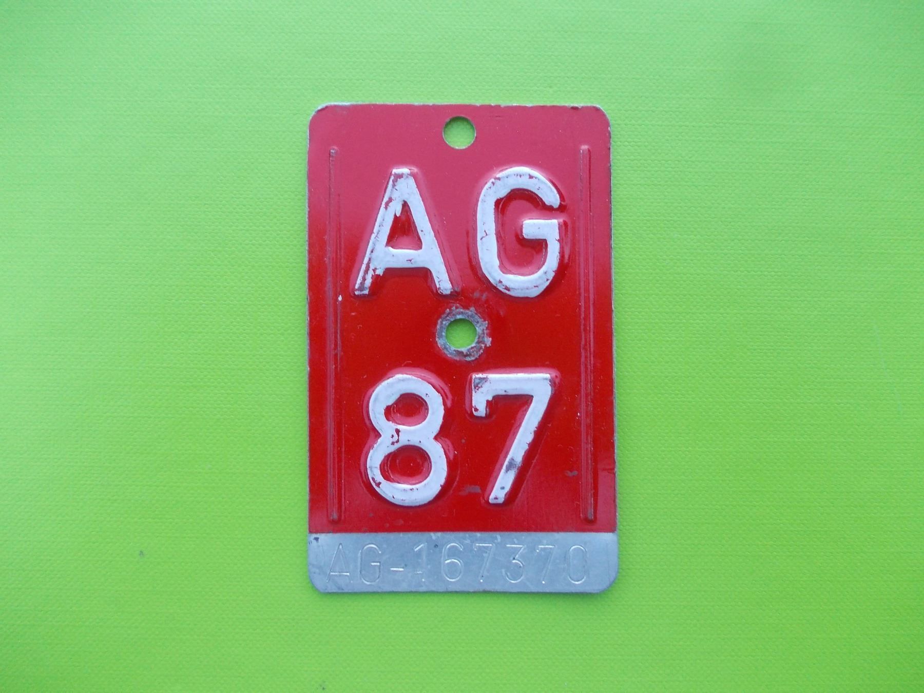 Schilder: Velonummer / Fahrradnummer AG 87 – Gebraucht aus Gsteigwiler von HORMIGA21