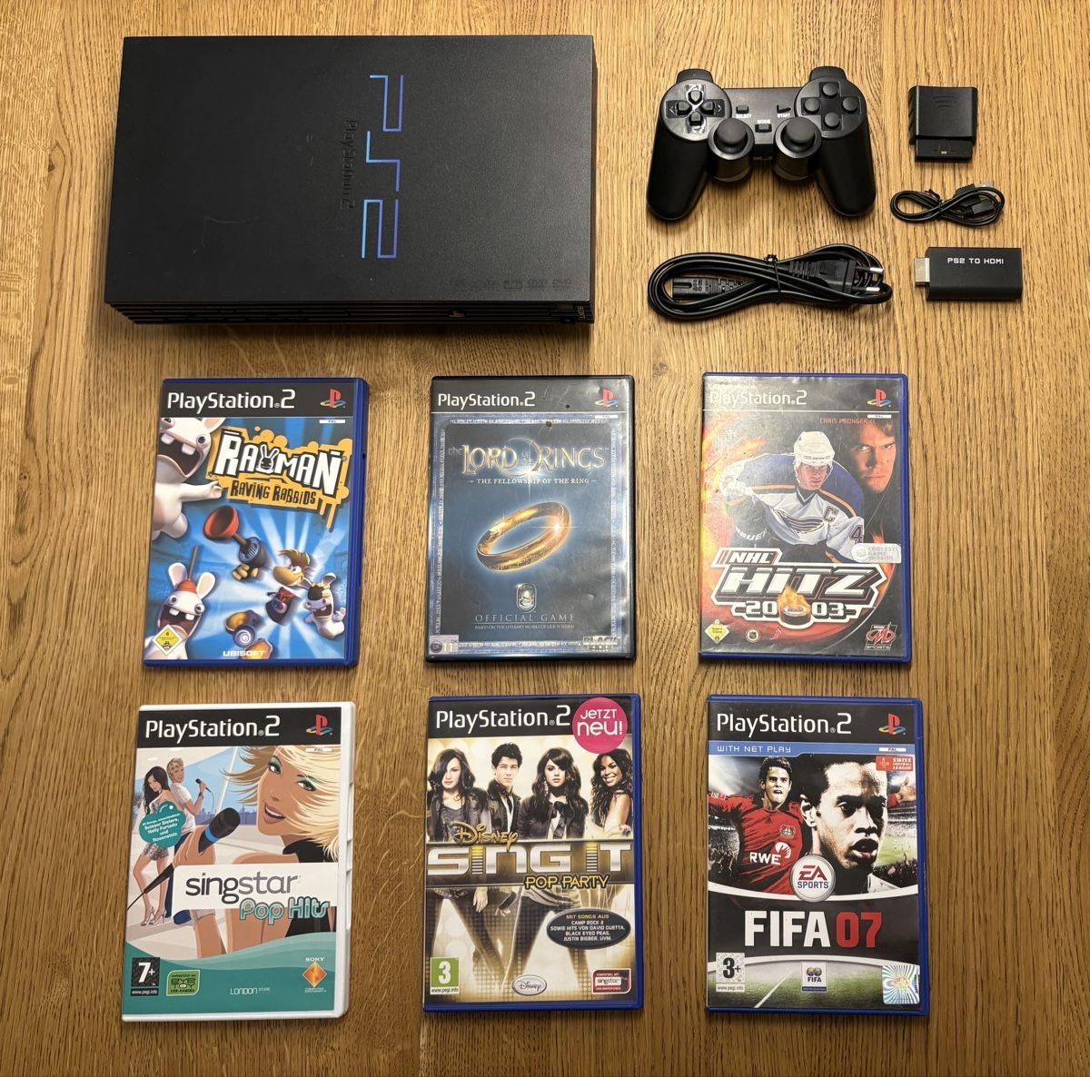 Sony Console: PlayStation 2 Set inkl. Controller, HDMI-Adapter & Spiele – Usato da Niederrohrdorf venduto da Olykesh