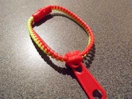 Armband Reissver. rot/hellgrün (Nr.1)