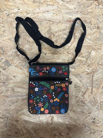 Black floral crossbody bag with adjustable strap 