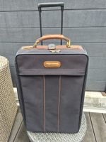 Valise Samsonite noire avec roulettes vintage