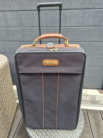 Valise Samsonite noire avec roulettes vintage