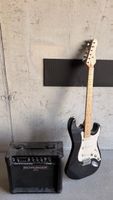 E-Gitarre schwarz mit Behringer Verstärker gebrauchtes 