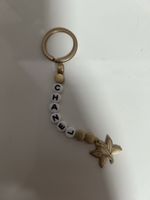 Chanel Schlüsselanhänger mit Lotus Anhänger, Goldig!